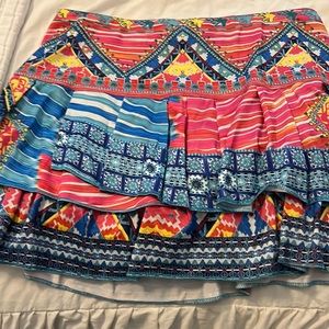 Adorable colorful print lucky in love tennis skirt.